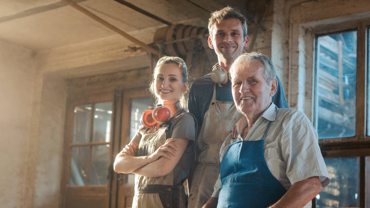 Generations of carpenters in their family business workshop